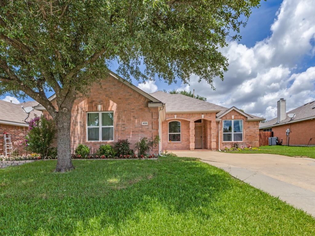 408 Highview Circle Royse City, TX 75189 - Photo 1 of 1 a front view of a house with a garden and trees
