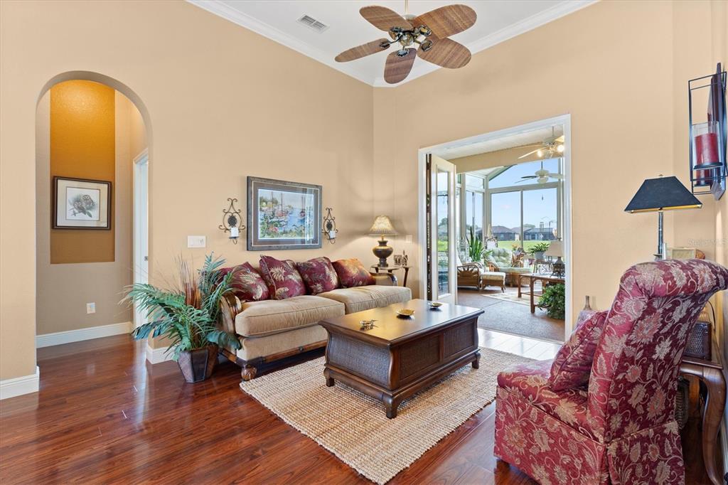 11839 Southeast 173rd Ln Road Summerfield, FL 34491 - Photo 11 of 49 a living room with furniture and wooden floor
