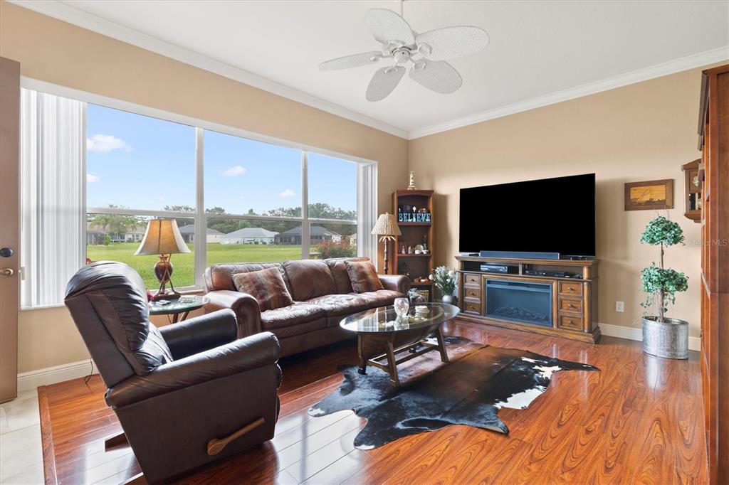 11839 Southeast 173rd Ln Road Summerfield, FL 34491 - Photo 16 of 49 a living room with furniture and a flat screen tv