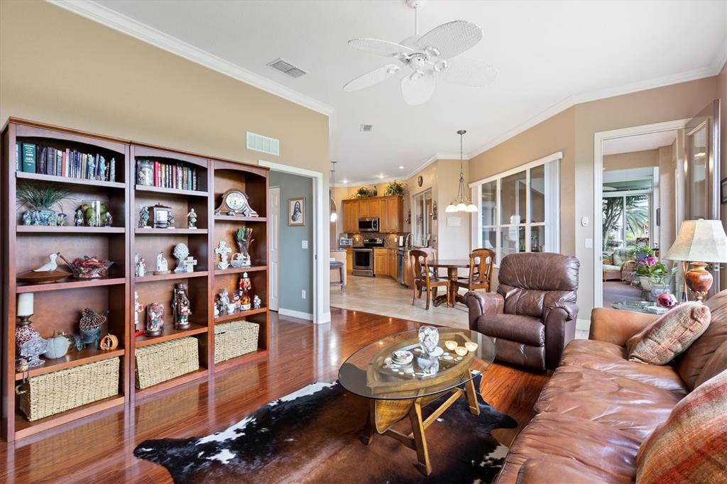 11839 Southeast 173rd Ln Road Summerfield, FL 34491 - Photo 17 of 49 a living room with furniture and a book shelf