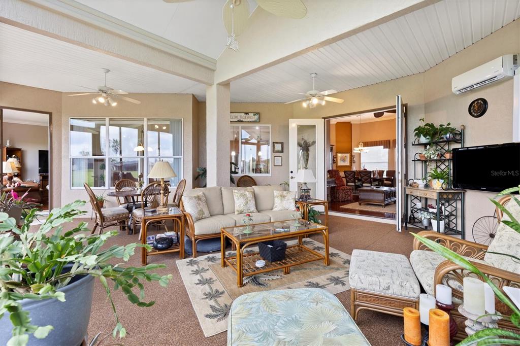 11839 Southeast 173rd Ln Road Summerfield, FL 34491 - Photo 19 of 49 a living room with furniture and a flat screen tv