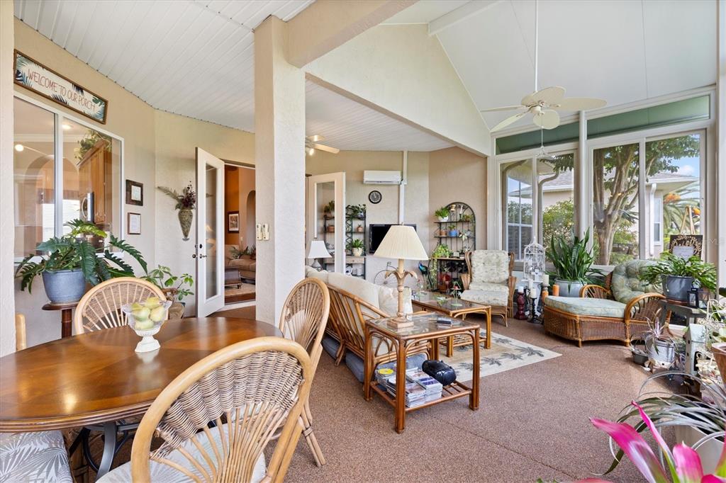 11839 Southeast 173rd Ln Road Summerfield, FL 34491 - Photo 21 of 49 a living room with furniture and floor to ceiling windows
