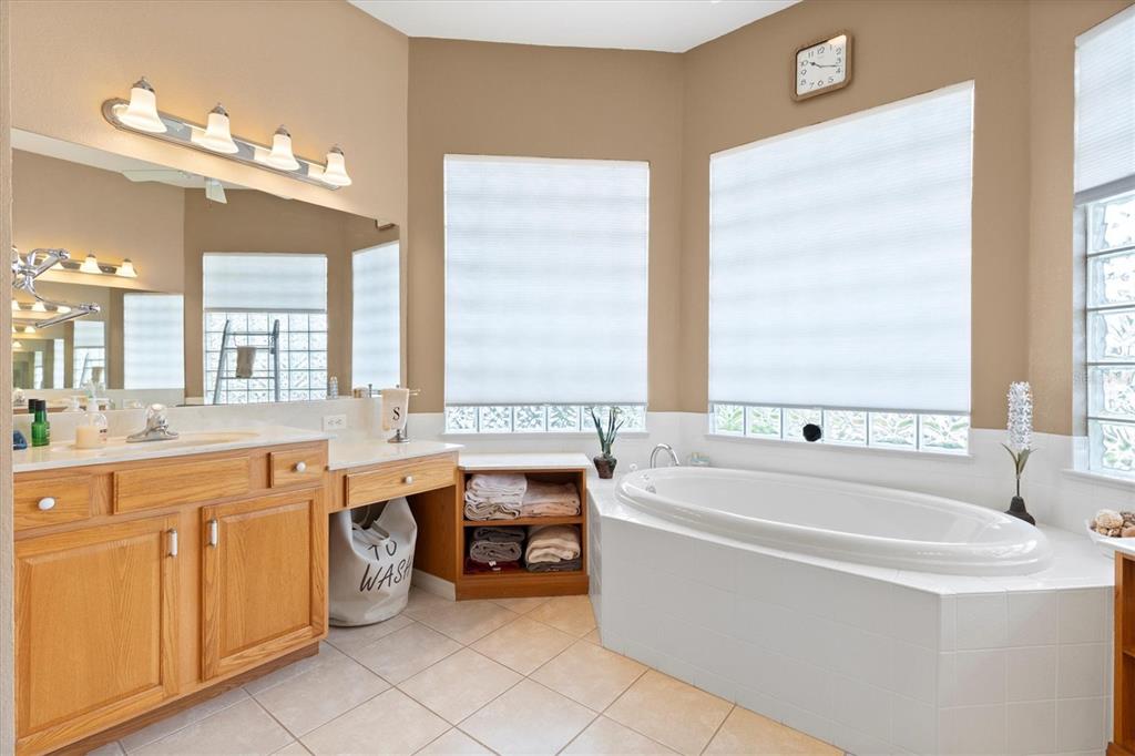 11839 Southeast 173rd Ln Road Summerfield, FL 34491 - Photo 25 of 49 a large white kitchen with a large window