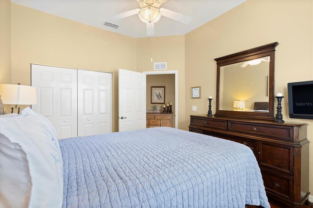 11839 Southeast 173rd Ln Road Summerfield, FL 34491 - Photo 29 of 49 a bedroom with a bed and a flat screen tv