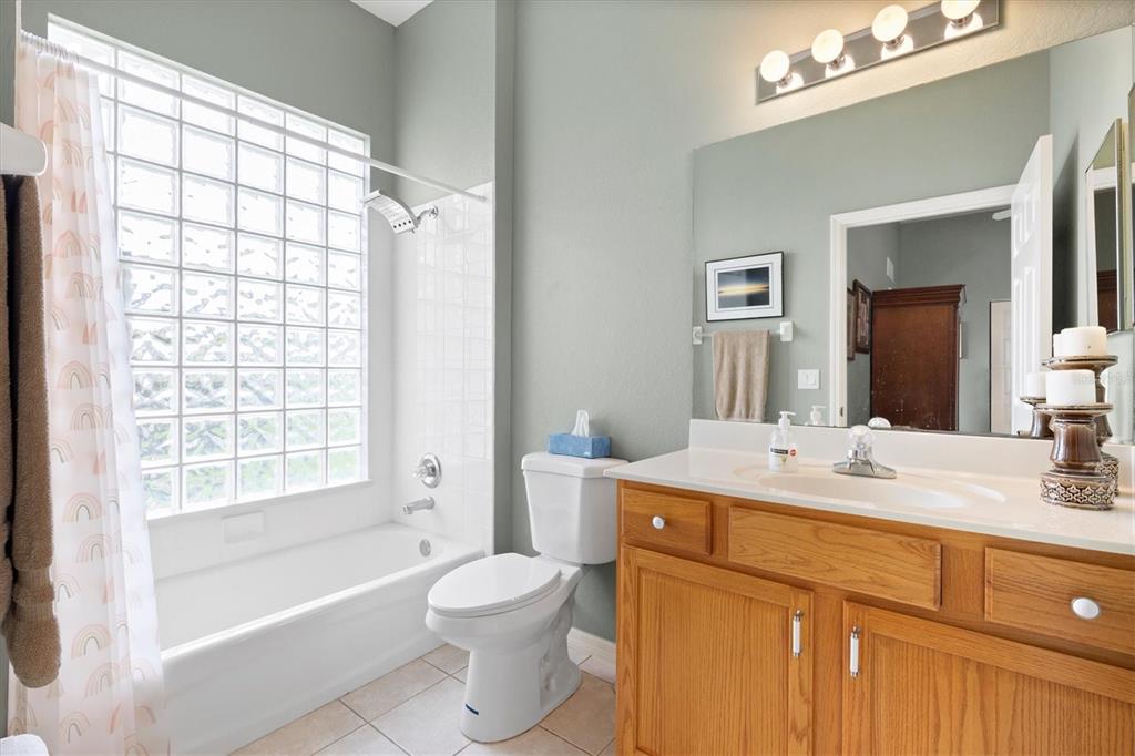 11839 Southeast 173rd Ln Road Summerfield, FL 34491 - Photo 33 of 49 a bathroom with a sink a toilet and shower