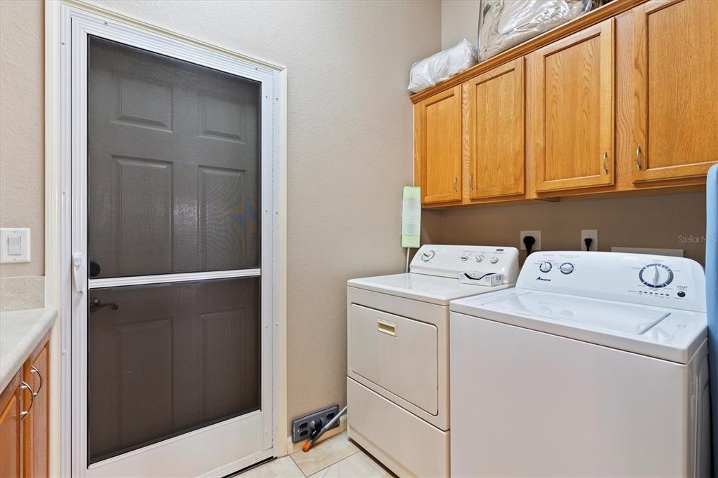 11839 Southeast 173rd Ln Road Summerfield, FL 34491 - Photo 34 of 49 a utility room with dryer and washer