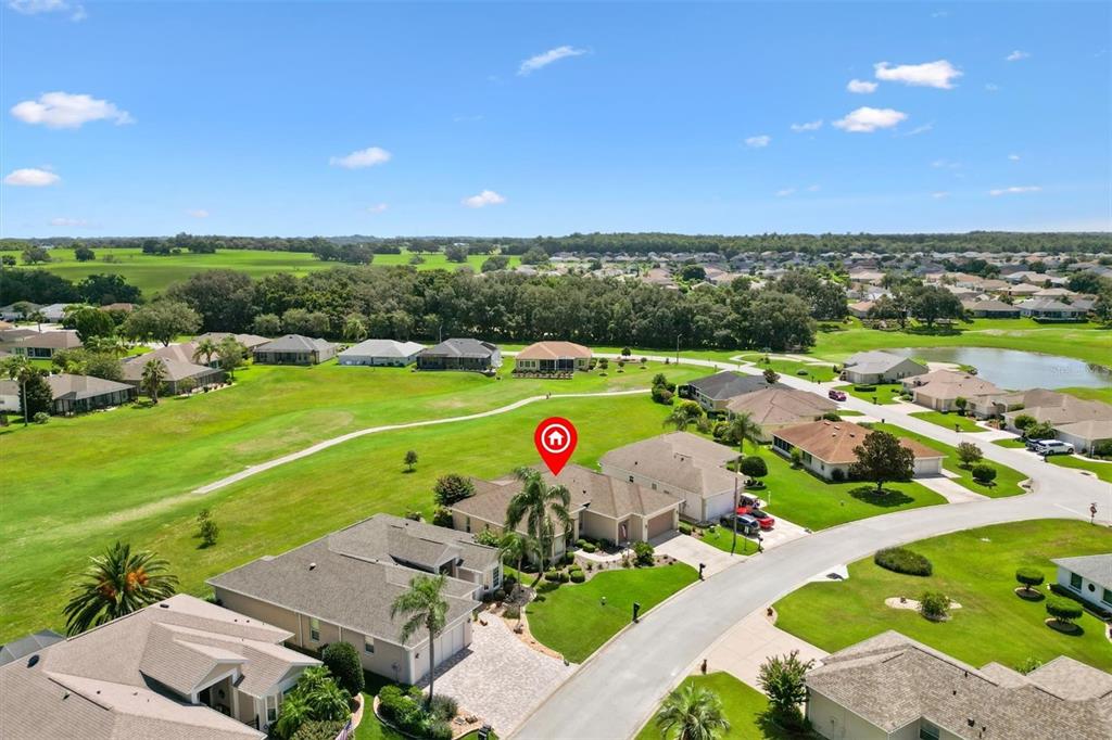 11839 Southeast 173rd Ln Road Summerfield, FL 34491 - Photo 48 of 49 an aerial view of a golf course with an outdoor space