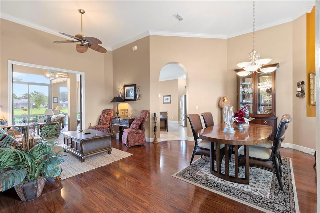 11839 Southeast 173rd Ln Road Summerfield, FL 34491 - Photo 8 of 49 a view of a dining room with furniture window and wooden floor