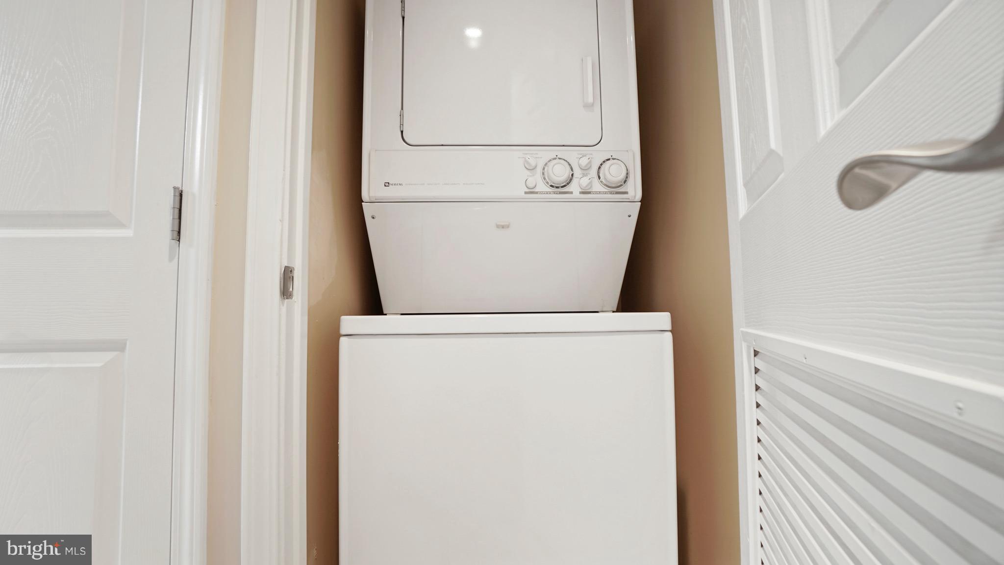 11710 Old Georgetown Road, Unit 1026 Rockville, MD 20852 - Photo 13 of 22 a utility room with dryer and washer