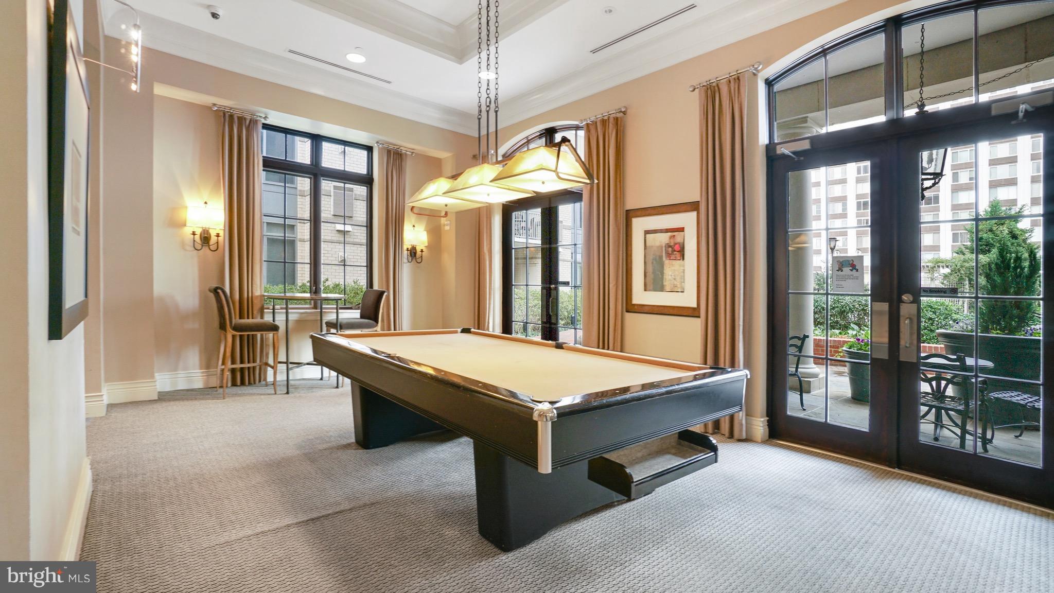 11710 Old Georgetown Road, Unit 1026 Rockville, MD 20852 - Photo 19 of 22 a room with pool table and windows