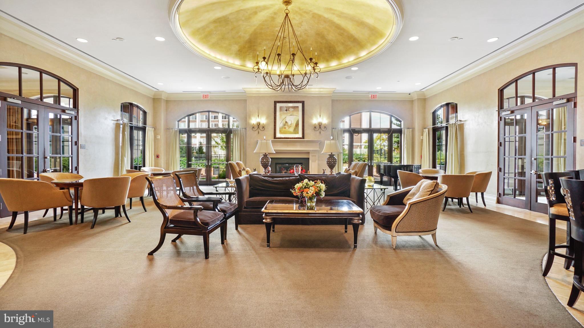 11710 Old Georgetown Road, Unit 1026 Rockville, MD 20852 - Photo 22 of 22 a living room with furniture a chandelier and a dining table