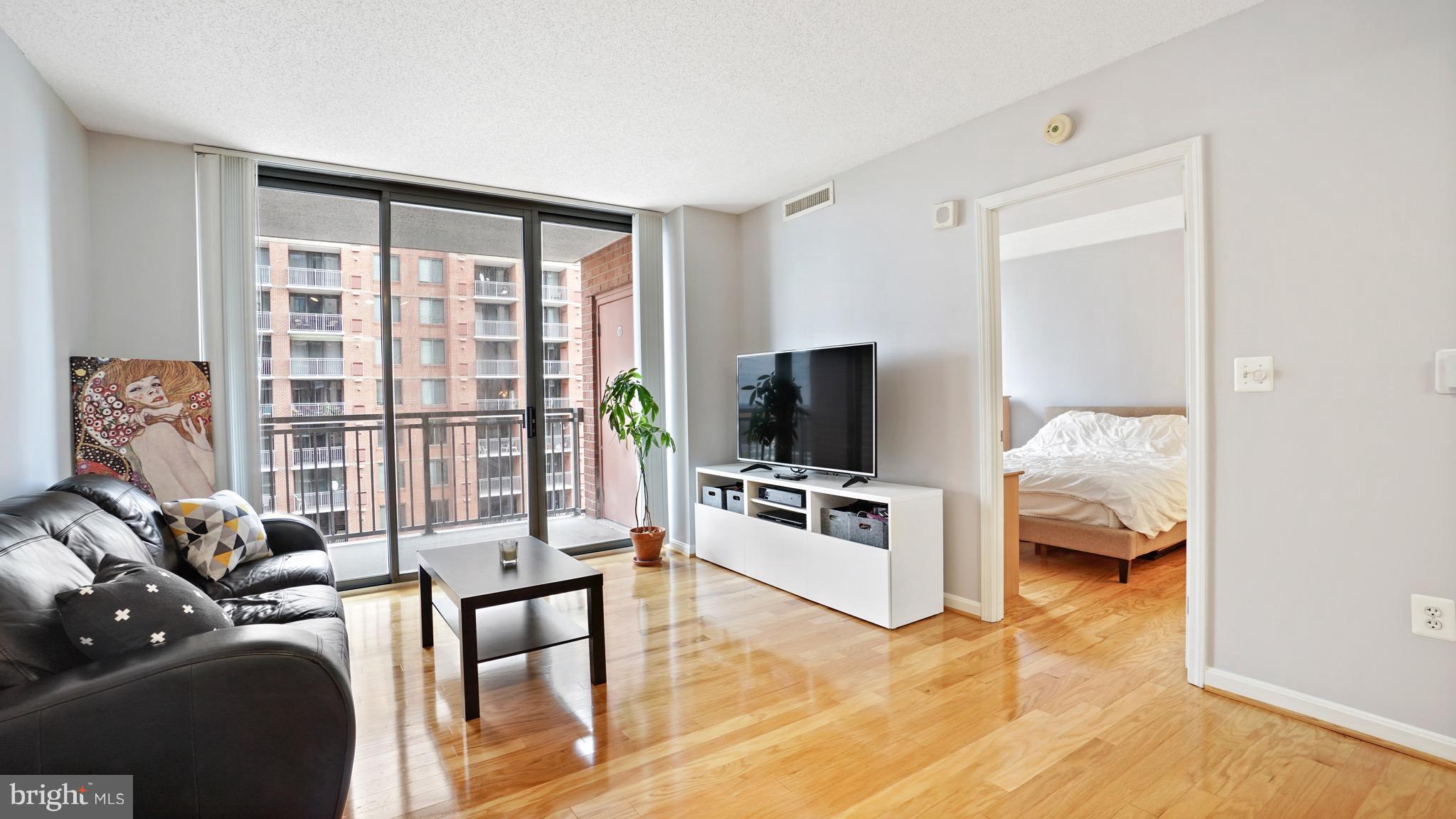 11710 Old Georgetown Road, Unit 1026 Rockville, MD 20852 - Photo 6 of 22 a bedroom with furniture and a flat screen tv