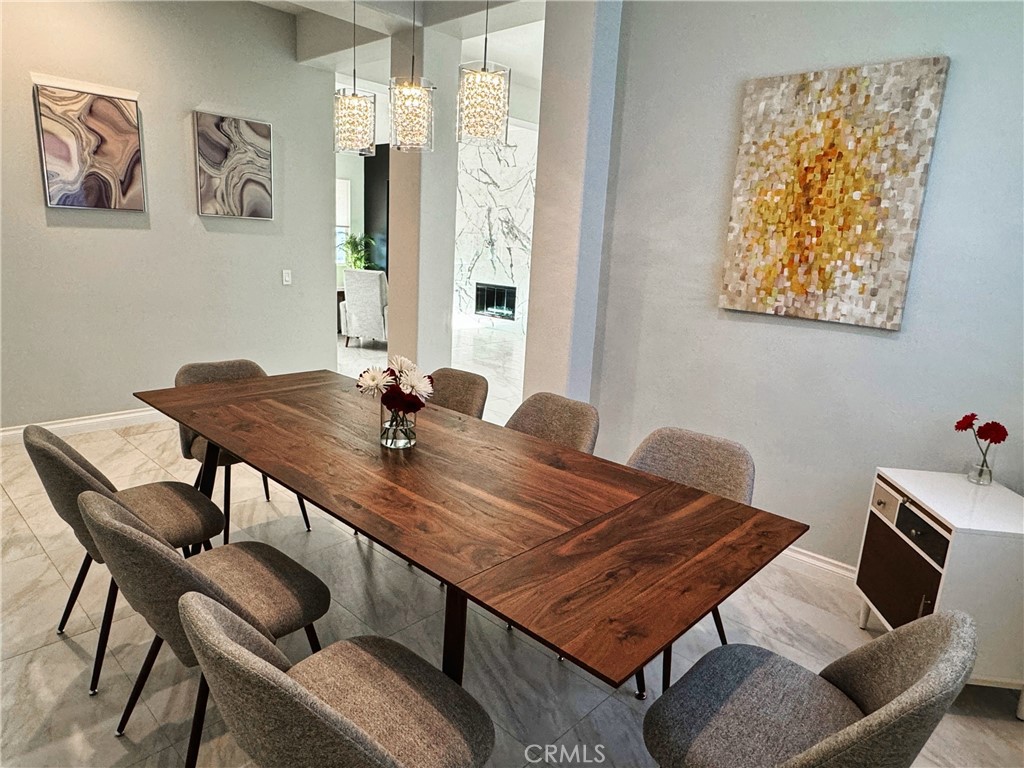 43244 Freesia Place Indio, CA 92201 - Photo 11 of 17 a view of a dining room with furniture and wooden floor