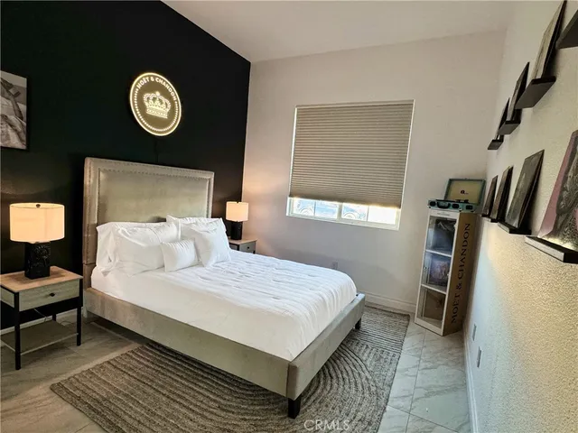 a bedroom with a bed and a table in it