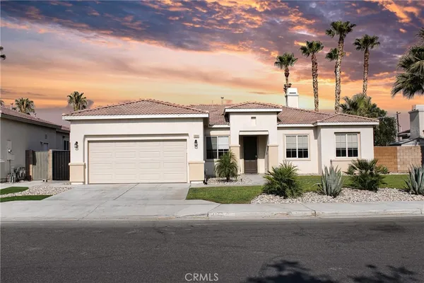 a front view of a house with a garage