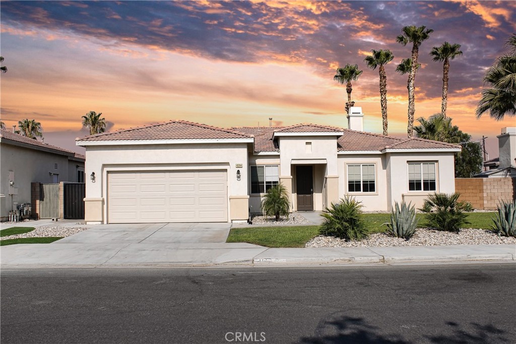 43244 Freesia Place Indio, CA 92201 - Photo 17 of 17 a front view of a house with a garage