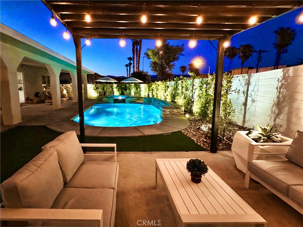 43244 Freesia Place Indio, CA 92201 - Photo 6 of 17 a view of a lobby with a couch and wooden floor