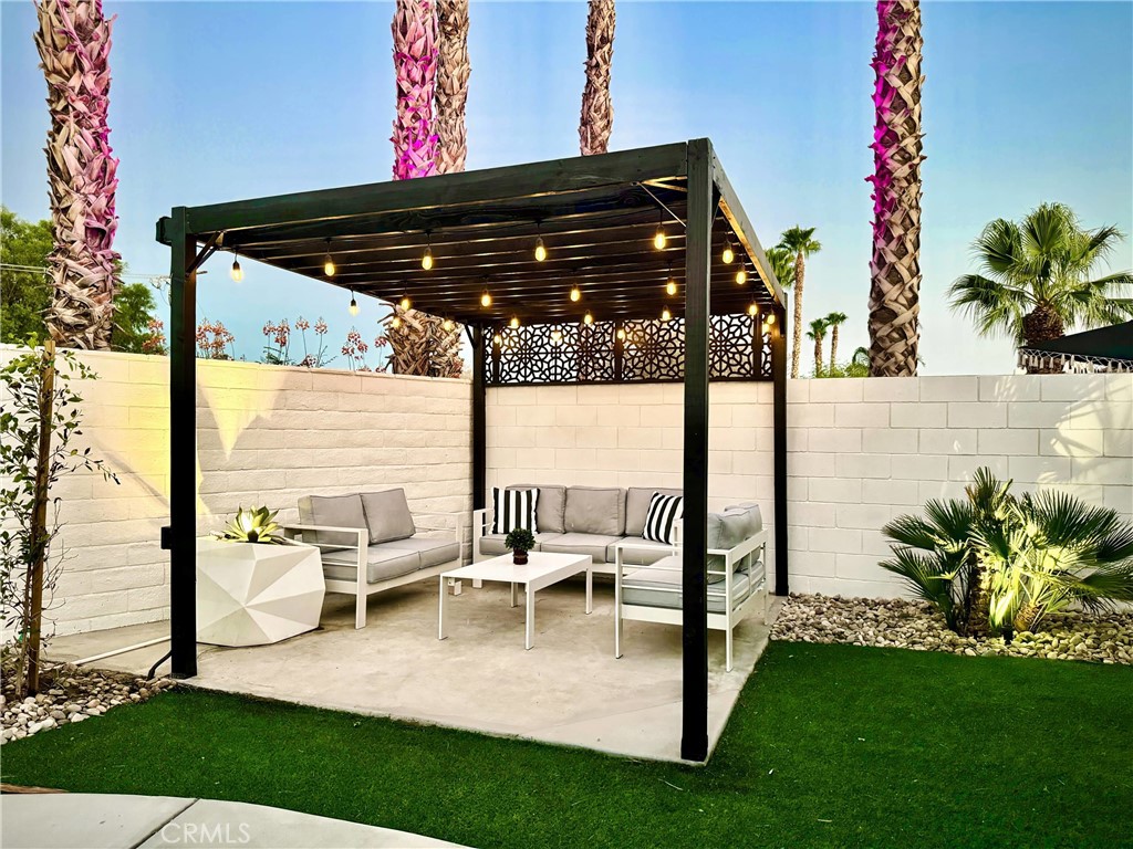 43244 Freesia Place Indio, CA 92201 - Photo 8 of 17 a view of outdoor space yard deck patio and swimming pool