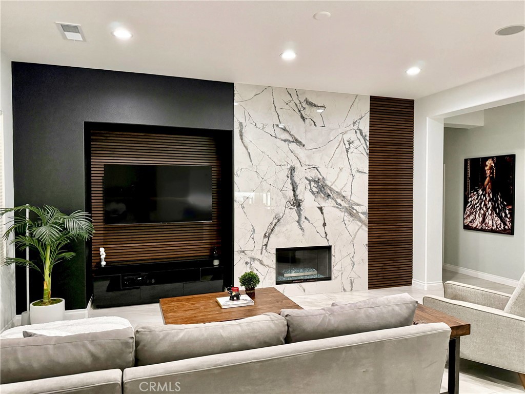 43244 Freesia Place Indio, CA 92201 - Photo 9 of 17 a living room with furniture and a fireplace