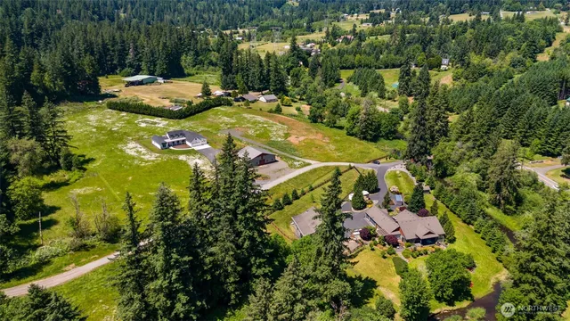 a view of a swimming pool with a yard and mountain view
