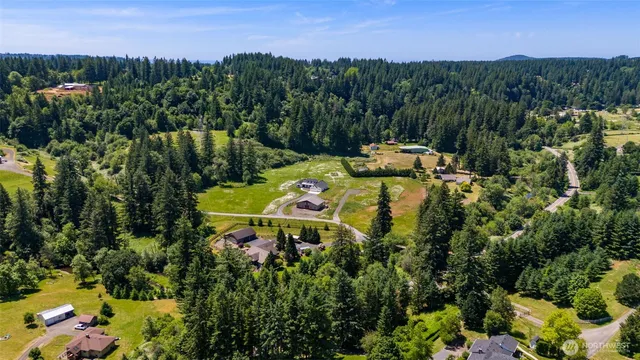 a view of a lake with a house in the background