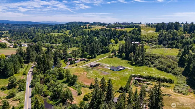 a view of a swimming pool with a yard