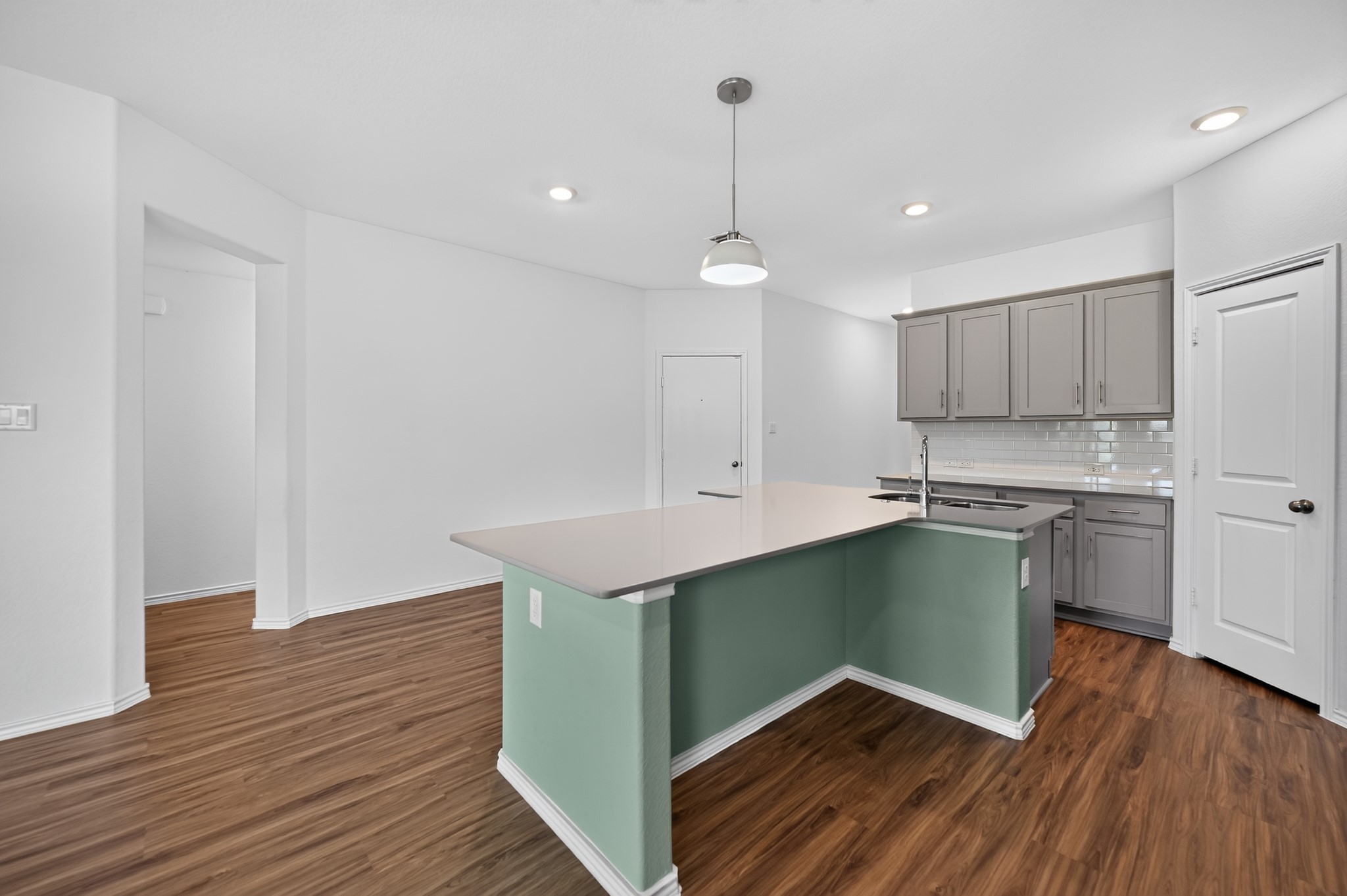 128 Konik Road Georgetown, TX 78626 - Photo 11 of 34 A well-appointed kitchen island with sleek counters and ample cabinetry awaits culinary adventures.