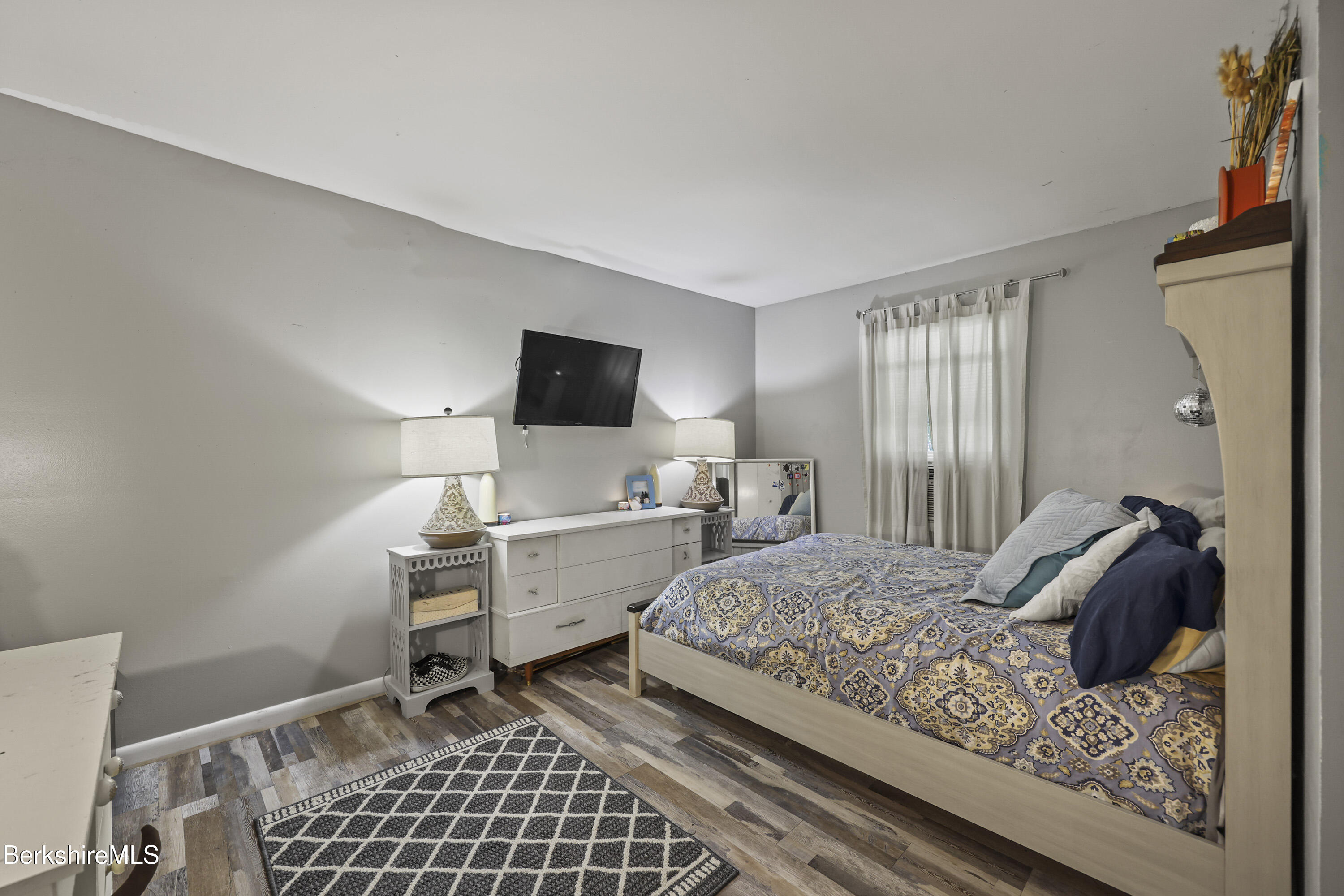 1052 Beaver Pond Meadows Road Williamstown, MA 01267 - Photo 13 of 38 a bedroom with a bed and a window