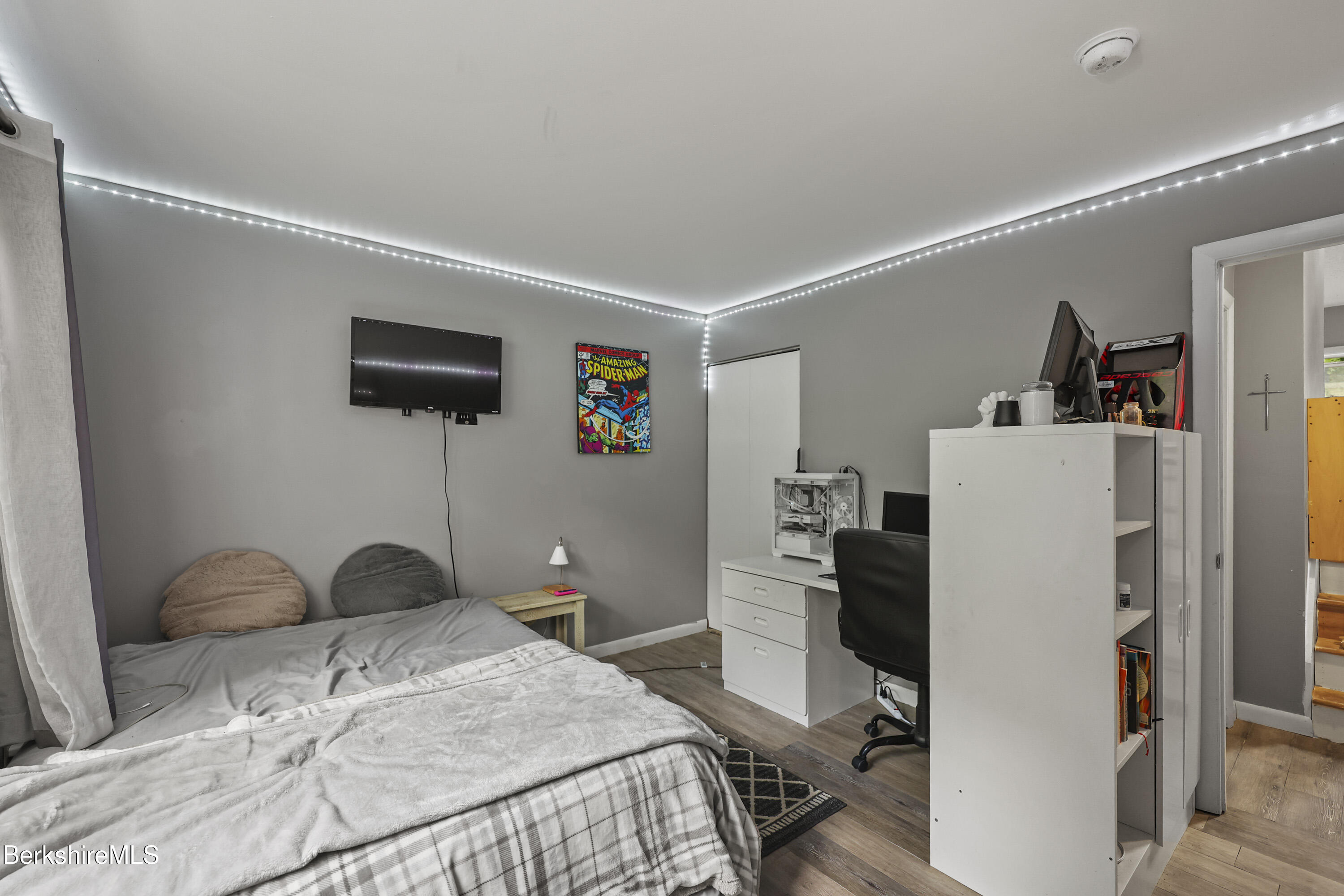 1052 Beaver Pond Meadows Road Williamstown, MA 01267 - Photo 17 of 38 a bedroom with a bed and a tv in it