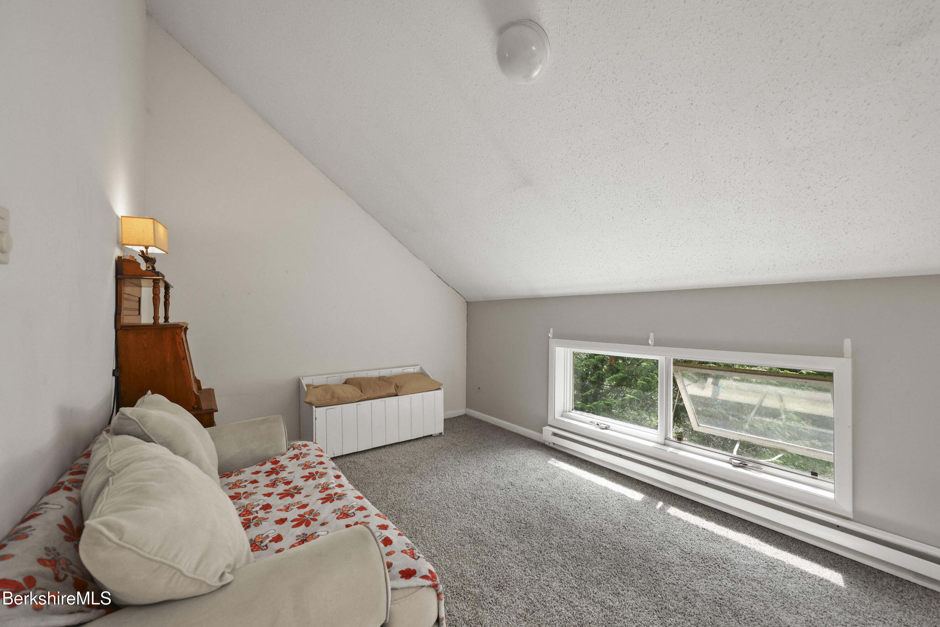 1052 Beaver Pond Meadows Road Williamstown, MA 01267 - Photo 21 of 38 a bedroom with a bed and a large window