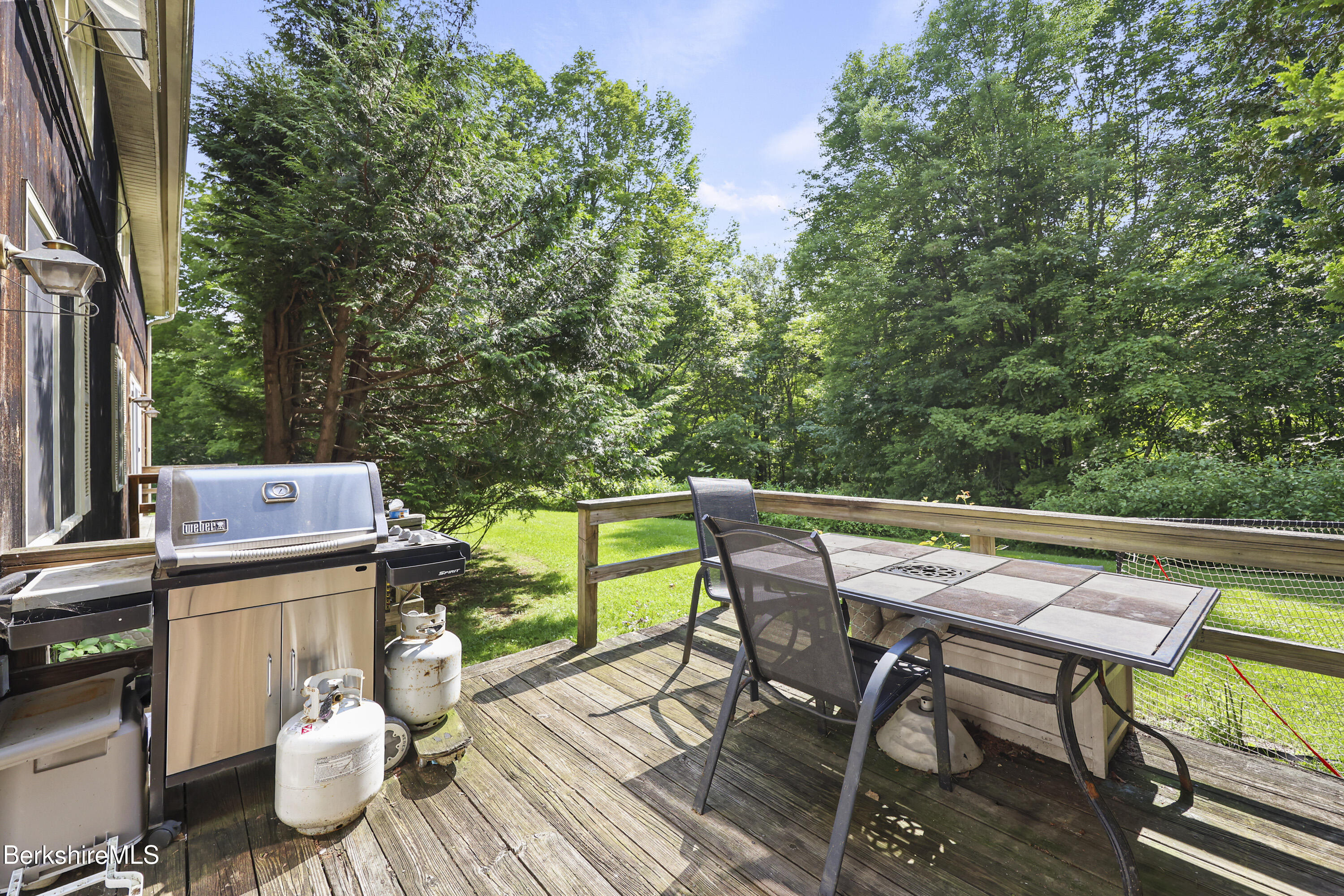 1052 Beaver Pond Meadows Road Williamstown, MA 01267 - Photo 27 of 38 a view of a table and chairs on the roof deck
