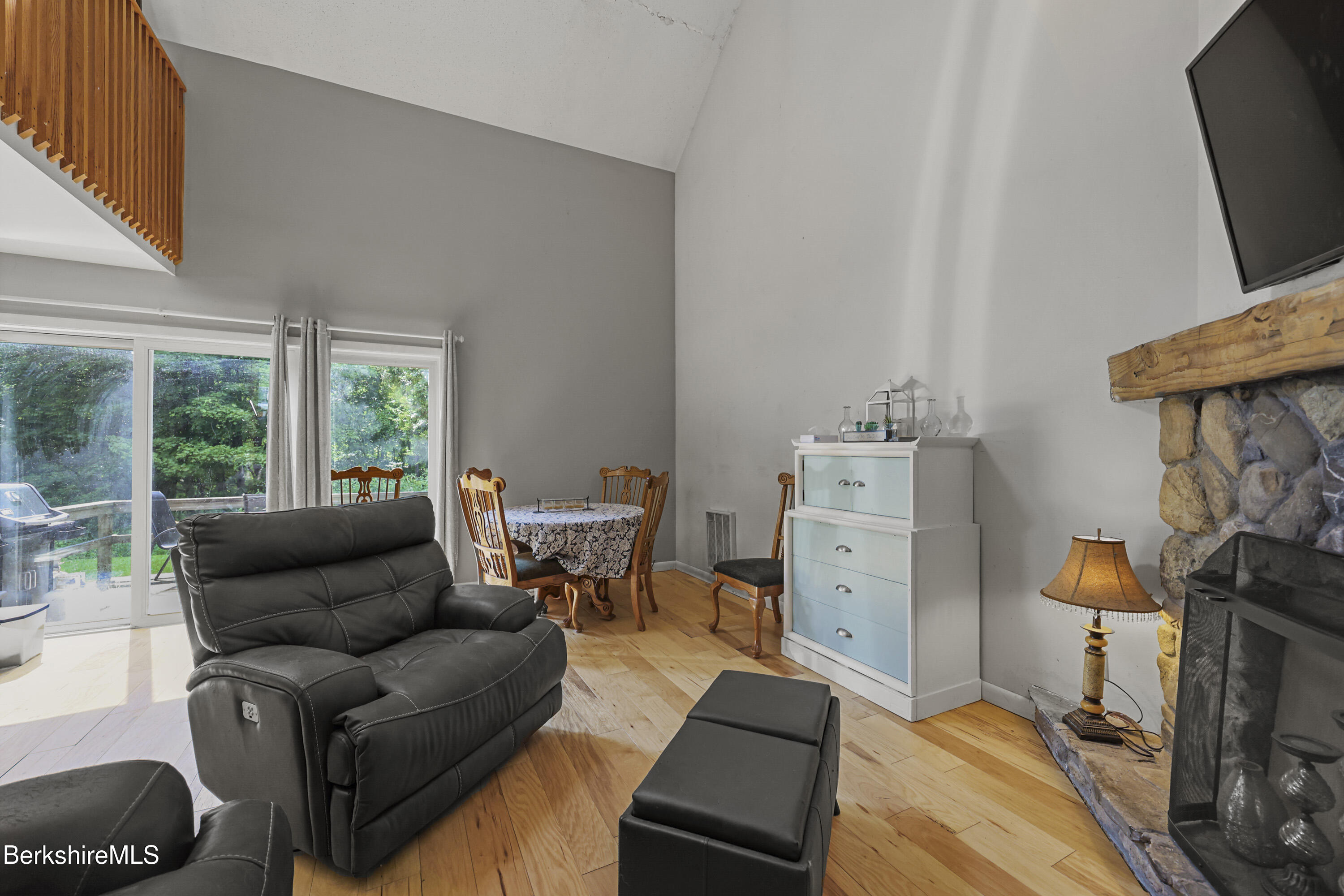 1052 Beaver Pond Meadows Road Williamstown, MA 01267 - Photo 7 of 38 a living room with furniture a flat screen tv and a window