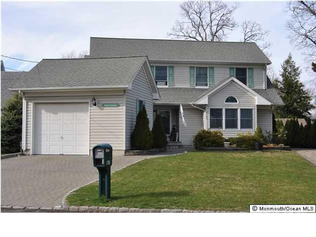 2105 Miller Road Point Pleasant, NJ 08742 - Photo 1 of 12 a front view of a house with a garden
