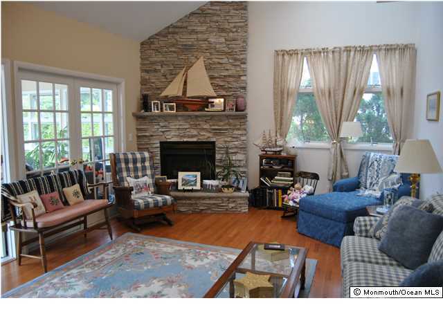 2105 Miller Road Point Pleasant, NJ 08742 - Photo 8 of 12 a living room with furniture and a fireplace