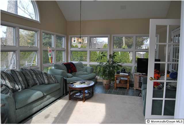 2105 Miller Road Point Pleasant, NJ 08742 - Photo 9 of 12 a living room with furniture potted plant and a large window