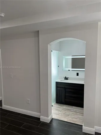 a bathroom with a sink and shower