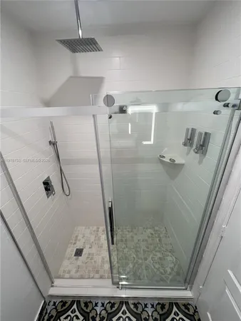 a bathroom with a sink toilet and mirror