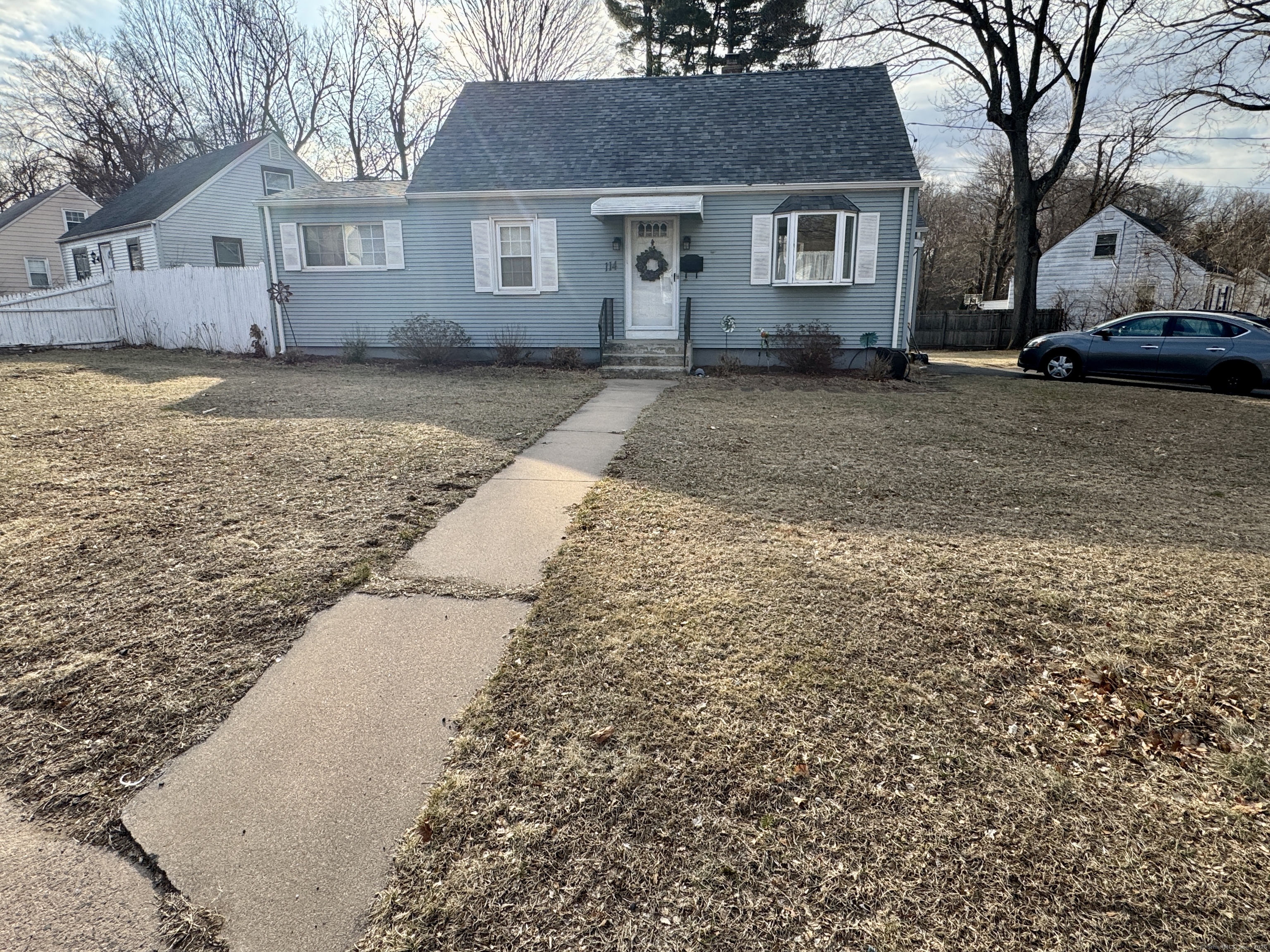 a front view of a house with a yard