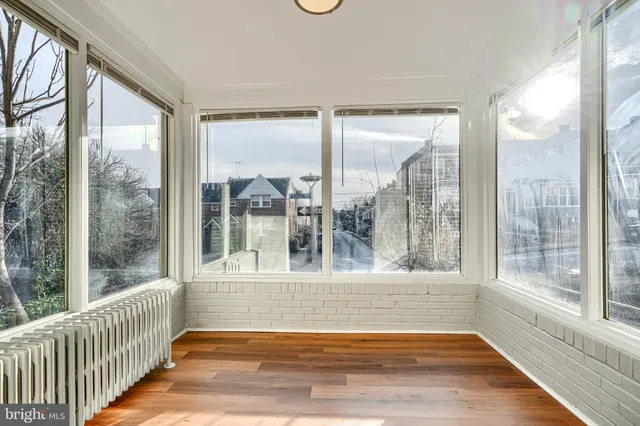 a view of a room with a large window