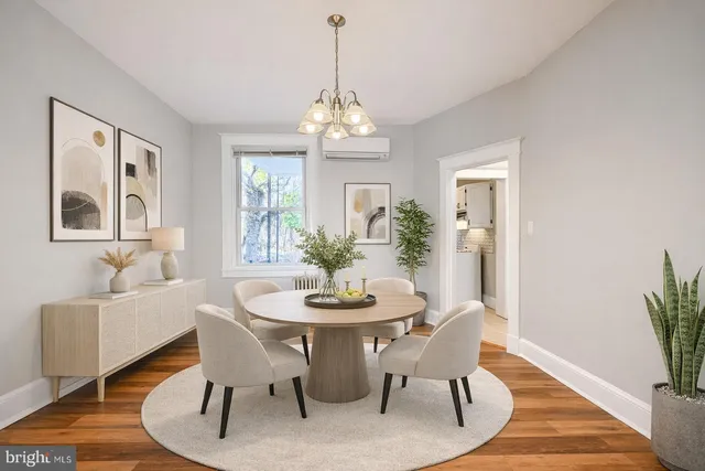 a dining room with furniture a livingroom and wooden floor