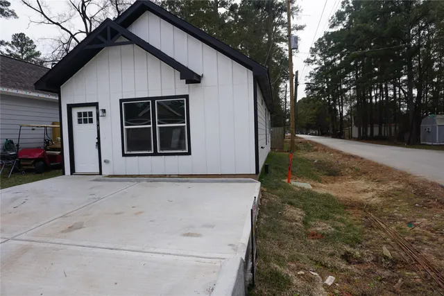 a kitchen with stainless steel appliances a sink a stove a microwave a sink a refrigerator and cabinets