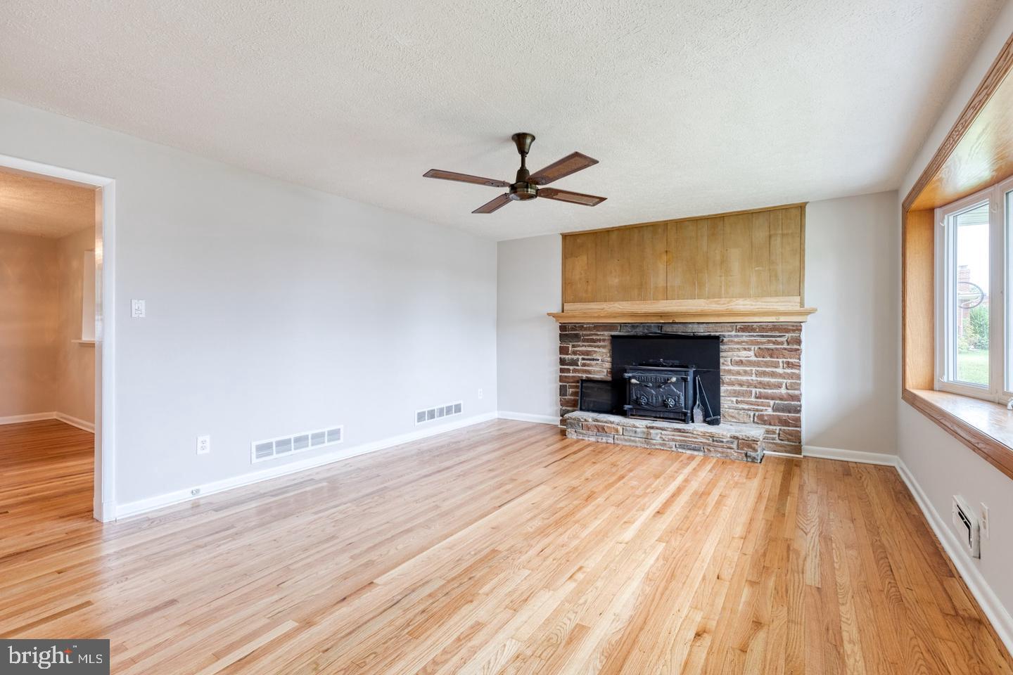 8306 Berkfield Road Baltimore, MD 21237 - Photo 6 of 29 Spacious living area with rustic charm.