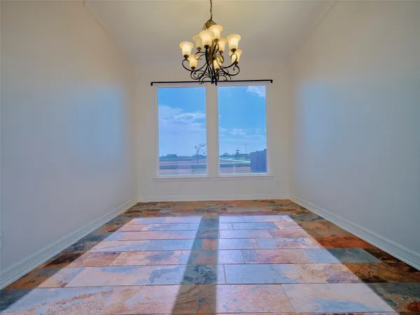 a large kitchen with stainless steel appliances granite countertop a stove and a sink