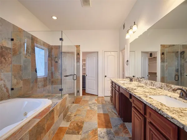 a bathroom with a granite countertop sink mirror and a