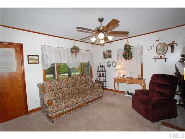 4317 Kerley Road Durham, NC 27705 - Photo 4 of 25 The Living Room has a Door that opens to a covered Front Porch.