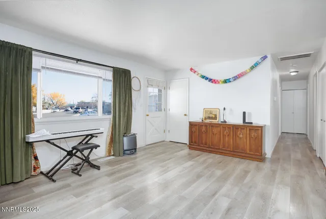 a room with furniture and a wooden floor