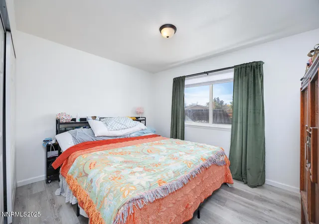 a bathroom with a sink vanity mirror and toilet