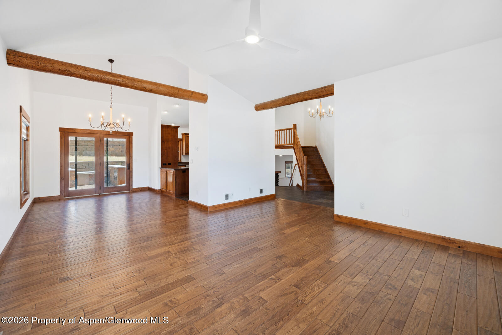 316 Faas Ranch Road New Castle, CO 81647 - Photo 16 of 50 a view of a livingroom with wooden floor and a ceiling fan
