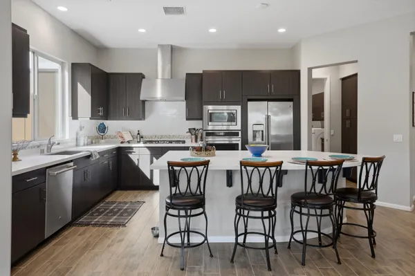 a kitchen with a sink stove and microwave