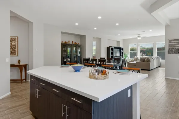 a kitchen with center island table and chairs in it